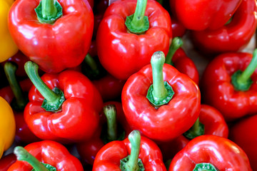 Closeup and crop heap of red bell pepper fit on screen background and wallpaper.