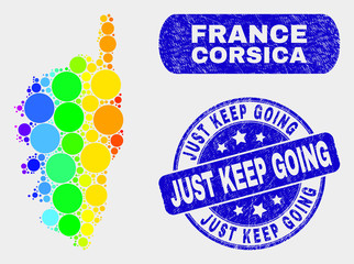 Rainbow colored dot Corsica map and stamps. Blue rounded Just Keep Going scratched seal stamp. Gradient rainbow colored Corsica map mosaic of scattered spheric dots.
