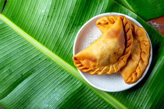Easter Island Tuna empanadas on banana palm tree leaves. Top view