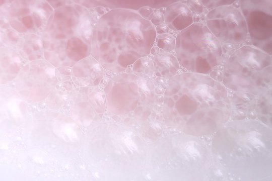 pink soap foam macro background.soap bubbles gently pink  color with a white gradient. Bath foam. Ease.Lightness and airiness
