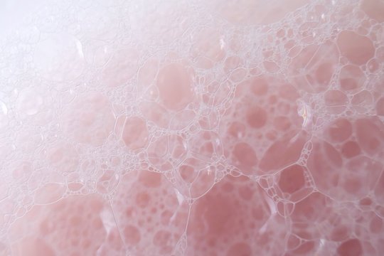 pink soap foam macro background.soap bubbles  pink pastel color with a white gradient. Bath foam. Ease.Lightness and airiness