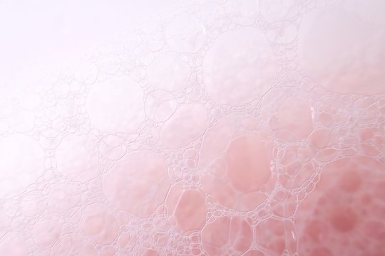 pink soap foam macro background.soap bubbles gently pink pastel color . Bath foam. Ease.Lightness and airiness