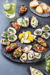 Seafood assorted platter Macha and mussels a la parmesana, mussels a la chalaca, clams with herb sauce