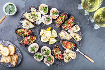 Seafood assorted platter Macha and mussels a la parmesana, mussels a la chalaca, clams with herb sauce