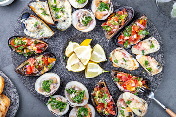 Seafood assorted platter Macha and mussels a la parmesana, mussels a la chalaca, clams with herb sauce