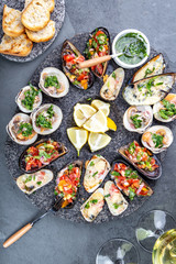 Seafood assorted platter Macha and mussels a la parmesana, mussels a la chalaca, clams with herb sauce