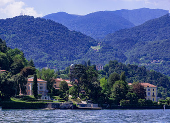 Fototapeta na wymiar villas and parks while sailing on Como Lake. Lombardy, Italy.
