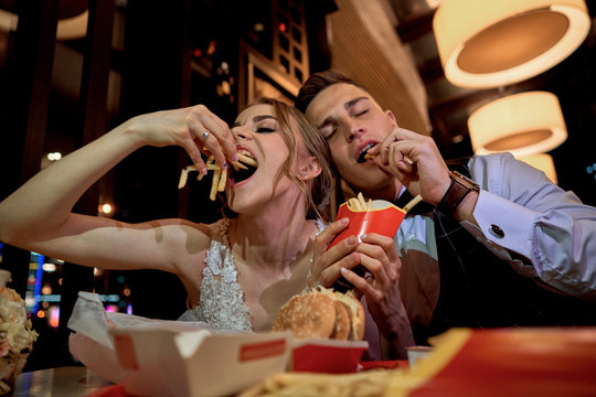 Couple Eating Burgers