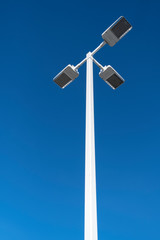 LED lighting pole against the clear blue sky on a street 