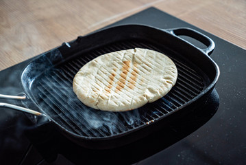 grilled pita bread on the pan