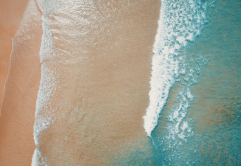 Aerial view to tropical sandy beach and blue ocean. Top view of ocean waves reaching shore on sunny day. Palawan, Philippines. - obrazy, fototapety, plakaty