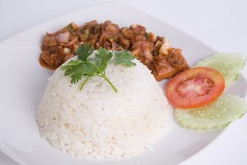 Larb Kai, Thai cuisine spicy salad of roasted chicken with chili sauce steamed rice on white plate