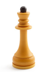 Chess piece of queen in front of white background.