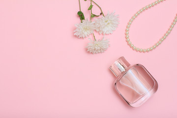 Women accessories and cosmetics on a pink background