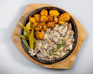Beef Stroganoff With Pickled Cucumbers And Baked Potatoes