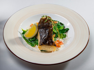 Fried Halibut With Spinach And Lemon Slice