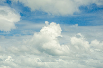 Blue sky and white clouds with blurred background patterns