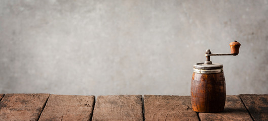 Vintage pepper mill on wooden table © One Pixel Studio