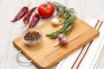 Ingredients for cooking meat or fish on wooden boards.