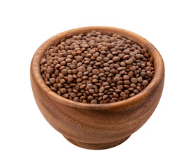 Brown lentils in wooden bowl isolated on white background