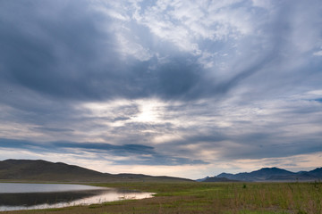 picturesque view of endless seascape with sunset reflecting on mirror water surface