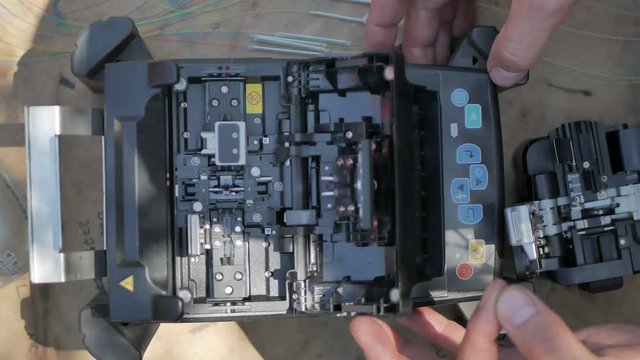fiber optic cable splice machine closeup