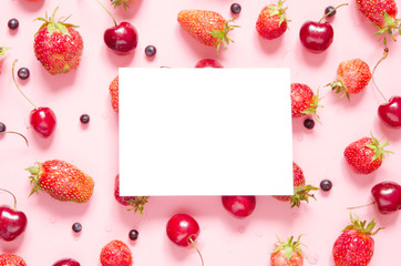 Creative layout of berries with space for text on white paper. Mockup. View from above. - Image