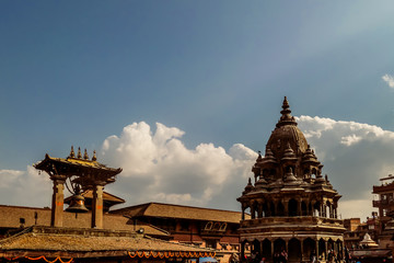 Bhaktapur Durbar Square Bell, Kathmandu, Nepal. A temple complex including an open air bell with cloud formation in the background. Concept of faith, consistency and spirituality.