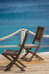 Wooden chairs on a deck platform