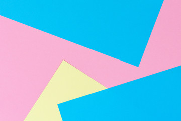 Abstract geometric shape pastel pink, yellow and light blue color paper background