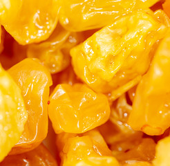 Yellow raisins as background