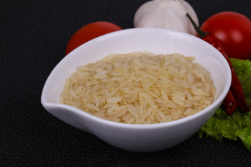 Raw uncooked rice in the bowl