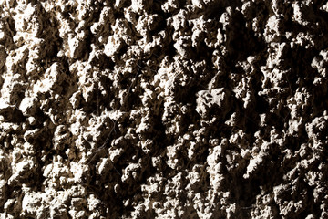 Black wall of sand and concrete as an abstract background