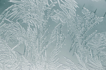 Snow patterns on glass as an abstract background
