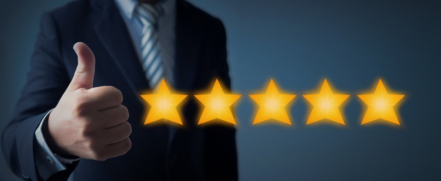 excellent service and best customer experience or good client , business man showing thumb up with 5 stars rating on dark blue background