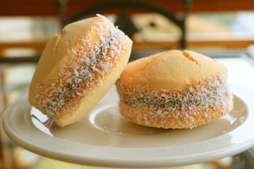 Pair of Alfajores, Traditional Latin American Sweetened Milk Filling Cookies Served on White Plate