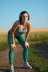 Fit sporty woman rest after jogging workout. Motivation, endurance, sports, fitness, health care