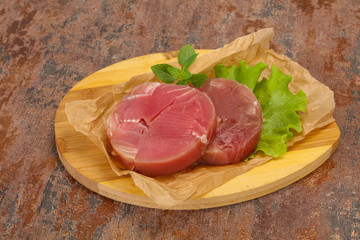 Raw tuna round steak for grill