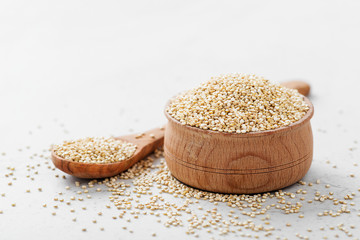 Bowl of healthy white quinoa seeds.