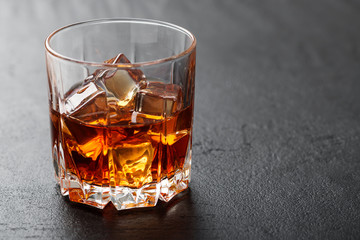 Glass of scotch whiskey and ice.