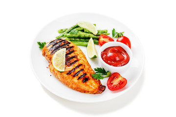Grilled chicken breast with lemon and green beans . isolated on white background