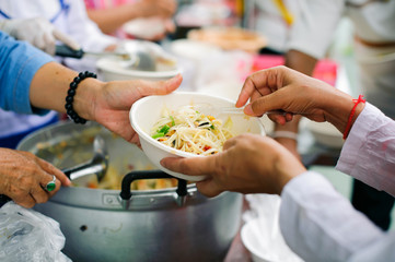 Help serving free food to the poor Needy : concept  Hunger