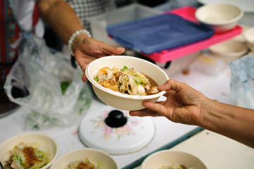 Food sharing in human societies can help homeless people : concept Sharing Food With Homeless