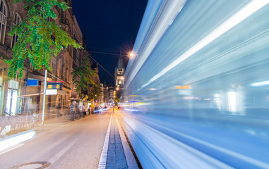 Fototapeta na wymiar Freiburg at night - Electric transporter at speed