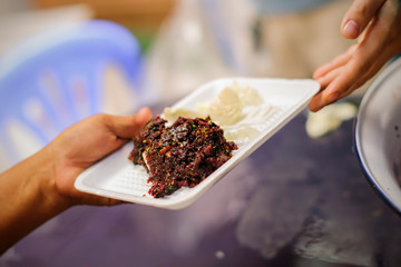 Help serving free food to the poor Needy : concept Sharing Food With Homeless