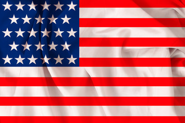 Fototapeta premium beautiful USA national flag on soft silk with soft folds, close-up, copy space