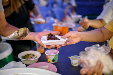 Free food for the poor and Food distribution : concept Sharing Food With Homeless