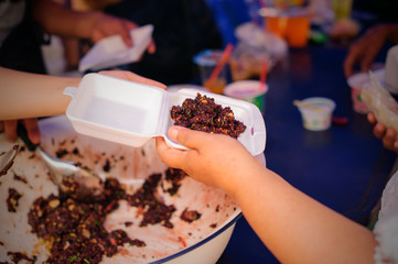 Free food for the poor and Food distribution : concept Sharing Food With Homeless