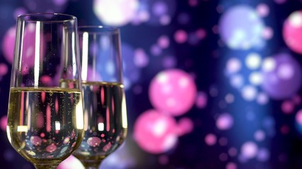 Two glasses of champagne with bubbles on blue blinking background.