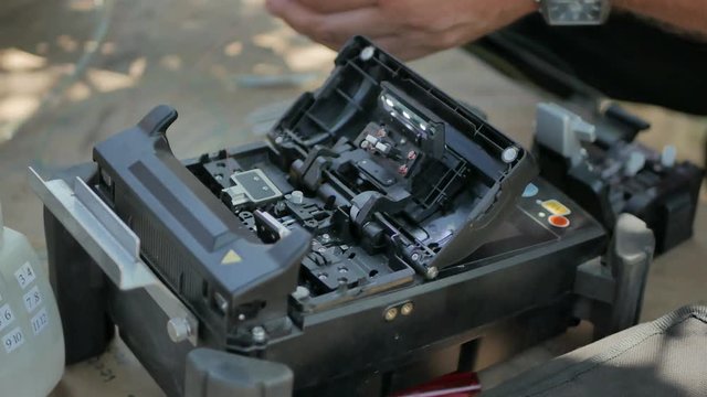 fiber optic cable splice machine closeup